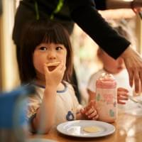 Child enjoying morning tea