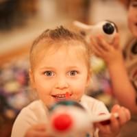 Smiling child playing with a toy