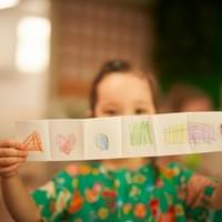 Child showing their shapes drawing