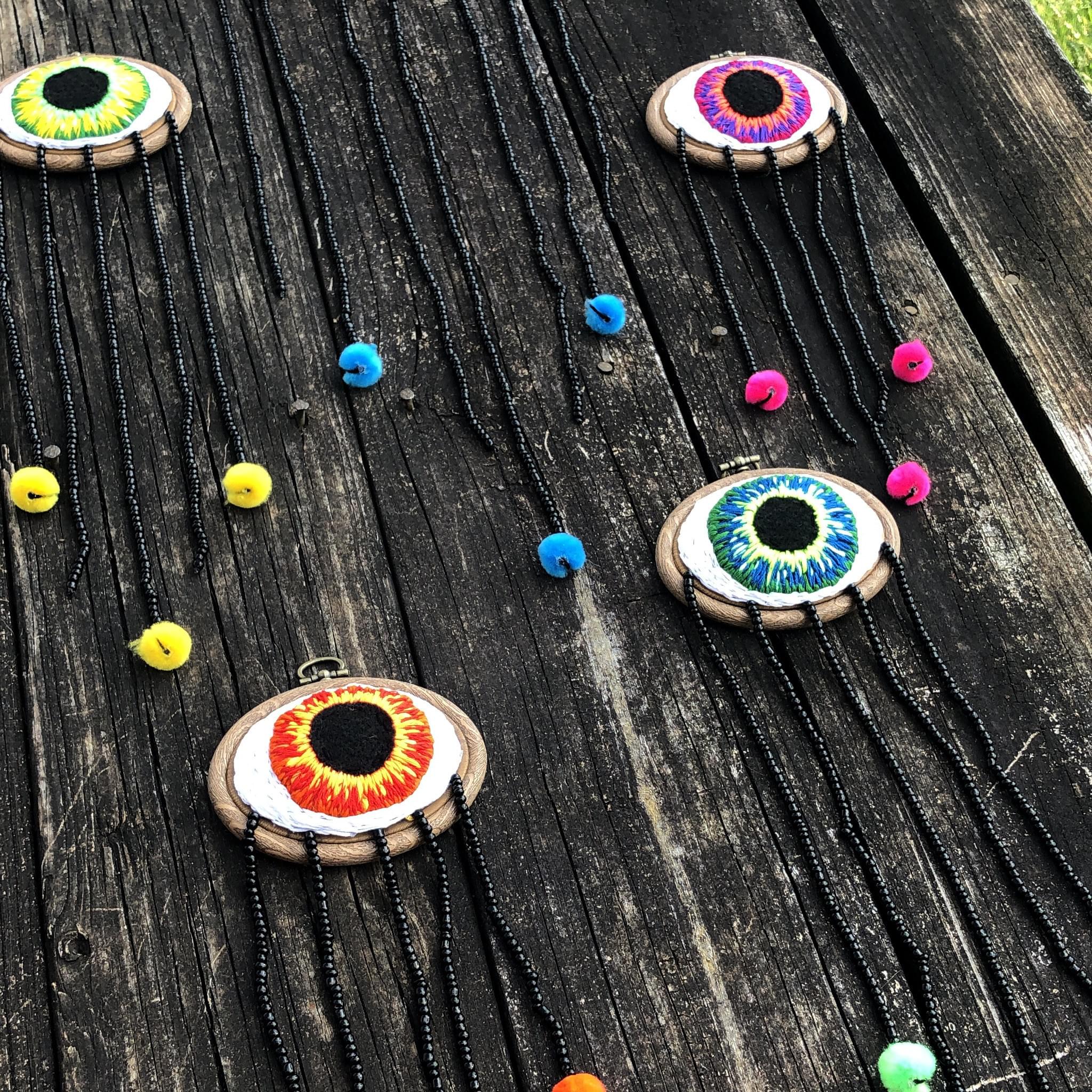 neon embroidered eyes