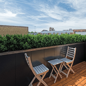 Tall planting wall, modular vertical sections assembled on site