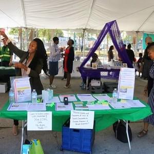 Two of our fabulous volunteers, Natalie Kuedituka & Britaney Chanel, greet each other at  the NULA resource table!