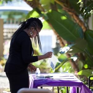 Marguerite Alexis, the event's organizer, setting up the NAMI resources table.