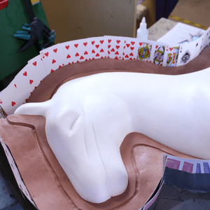 Oil based clay and playing cards provide the final dam, so the the silicone can be contained without risk of leakage or cure inhibition. 