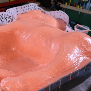 Platinum grade silcone is brushed onto the surface of the piece in layers, building up a consistent thickness of silicone. 