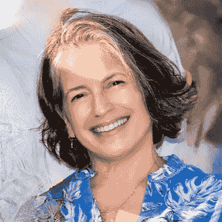 PIcture of Dr. Ferguson wearing blue shirt and red and blue flowered shawl, standing in front of columns in Balboa Park, San Diego. Photo Credit: Xavier Bailey Photography PIcture of Dr. Ferguson wearing blue shirt and red and blue flowered shawl, standing in front of columns in Balboa Park, San Diego. Photo Credit: Xavier Bailey Photography