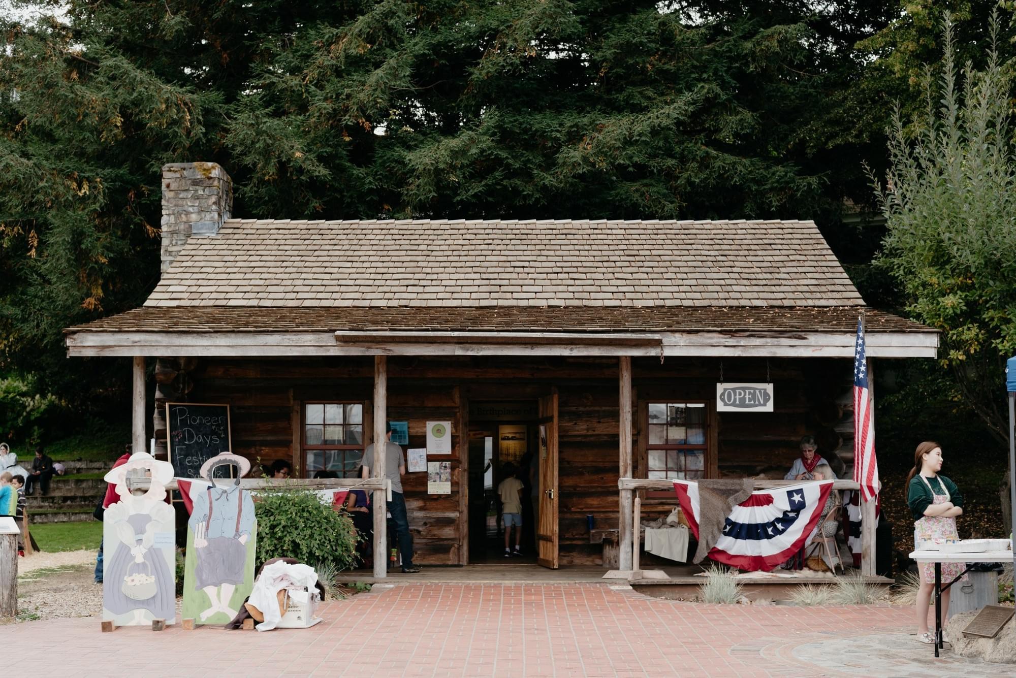 Job Carr Cabin Museum historic cabin exterior during a public program.