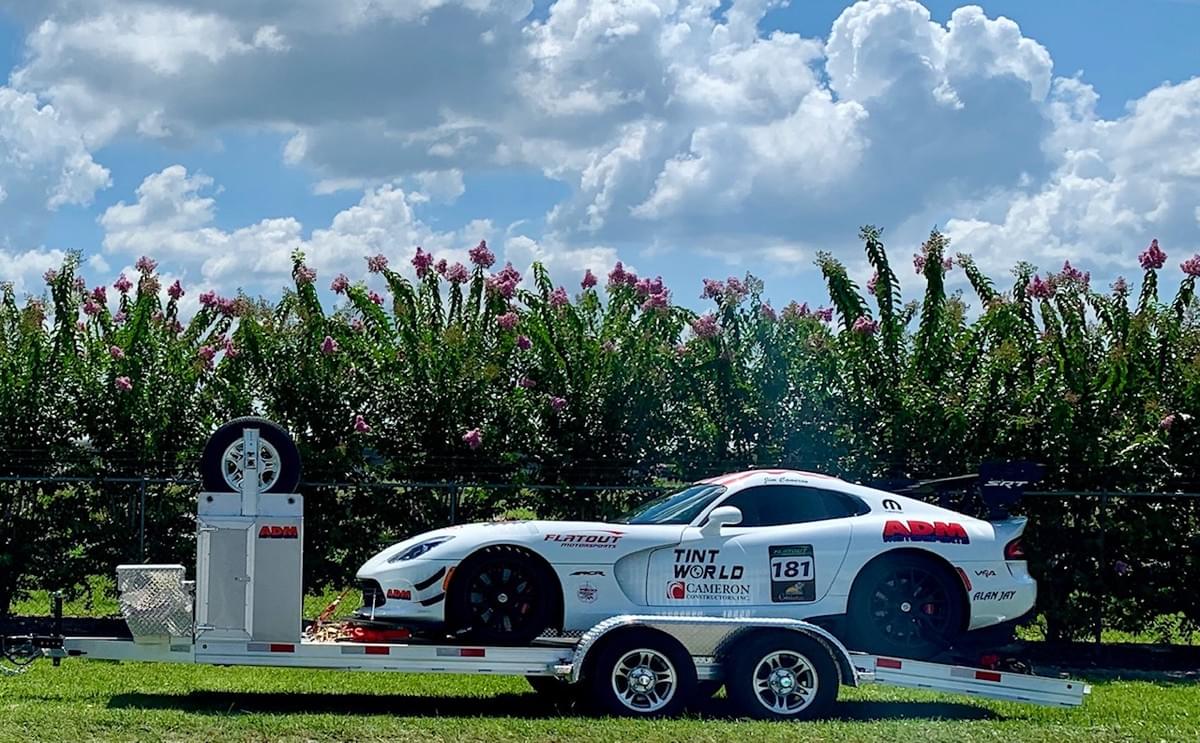 Aluminum open car hauler with sports car