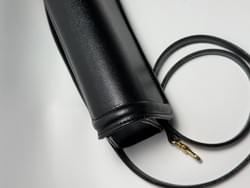 Black Italian leather clutch bag with gold metal chain, structured flap design, luxury minimalist handbag, Made in Italy craftsmanship, wholesale leather accessories