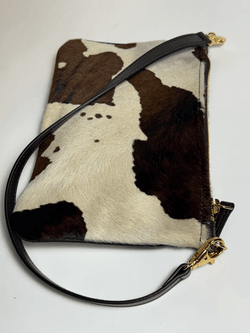 Cowhide leather convertible pouch with brown and white animal pattern, zip closure and removable shoulder strap, luxury Italian haircalf mini bag, Made in Italy craftsmanship, wholesale leather accessories.