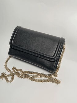 Black Italian leather clutch bag with gold metal chain, structured flap design, luxury minimalist handbag, Made in Italy craftsmanship, wholesale leather accessories