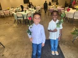 Mother's Day Breakfast hosted by the men, but these two young men presented each mom with a rose