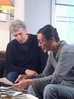 Jack and Yvonne looking at stills from her films