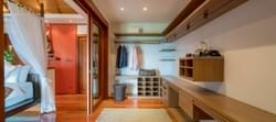 The magnificent walk-in wardrobe room off the master bedroom on the upper level