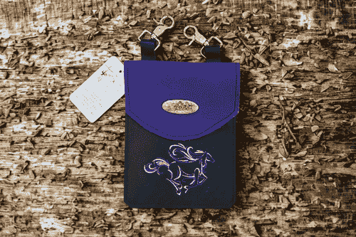 Black and purple hip bag with embroidered horse.