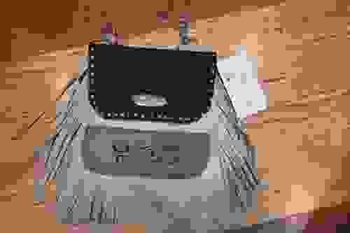 Brown hip bag with embroidered horse.