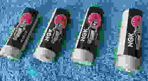 Item #240 NGK Racing Spark Plugs(4) B-11EN NOS ALUMINIUM TUBES AND CAPS COLLECTABLE?