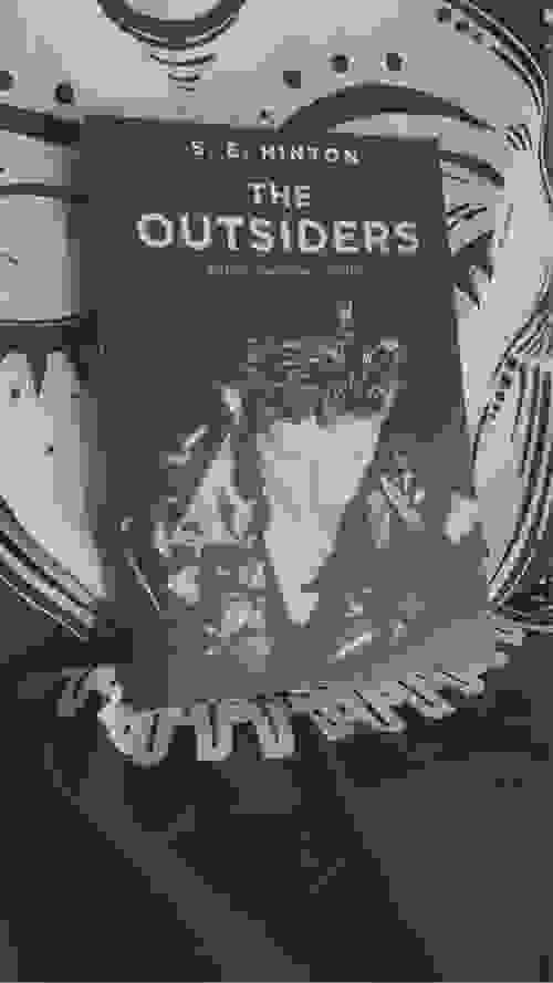 THE OUTSIDERS BY: S.E. HINTON