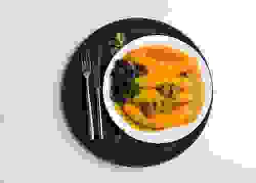 Katogo Served with Beef, Greens, and Avocado