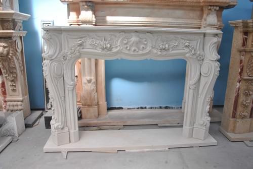 Hand carved white marble fireplace for homes usage