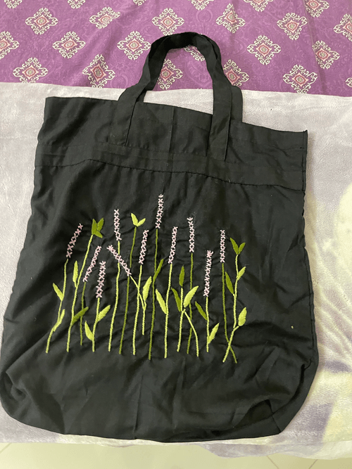 Black bag with small pink flowers