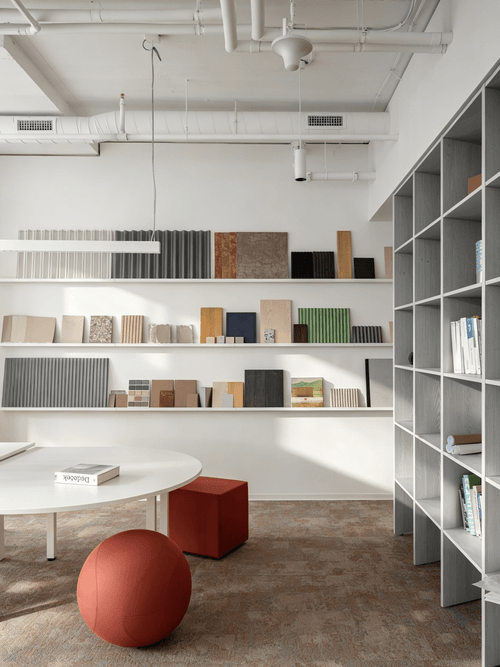 Healing Office with Exposed Industrial Ceiling and Log Wood Elements