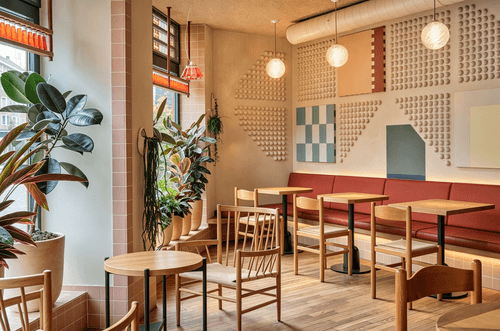 Sunlight drifts into the space, recreating the laid-back dining vibe of Southern European countrysid