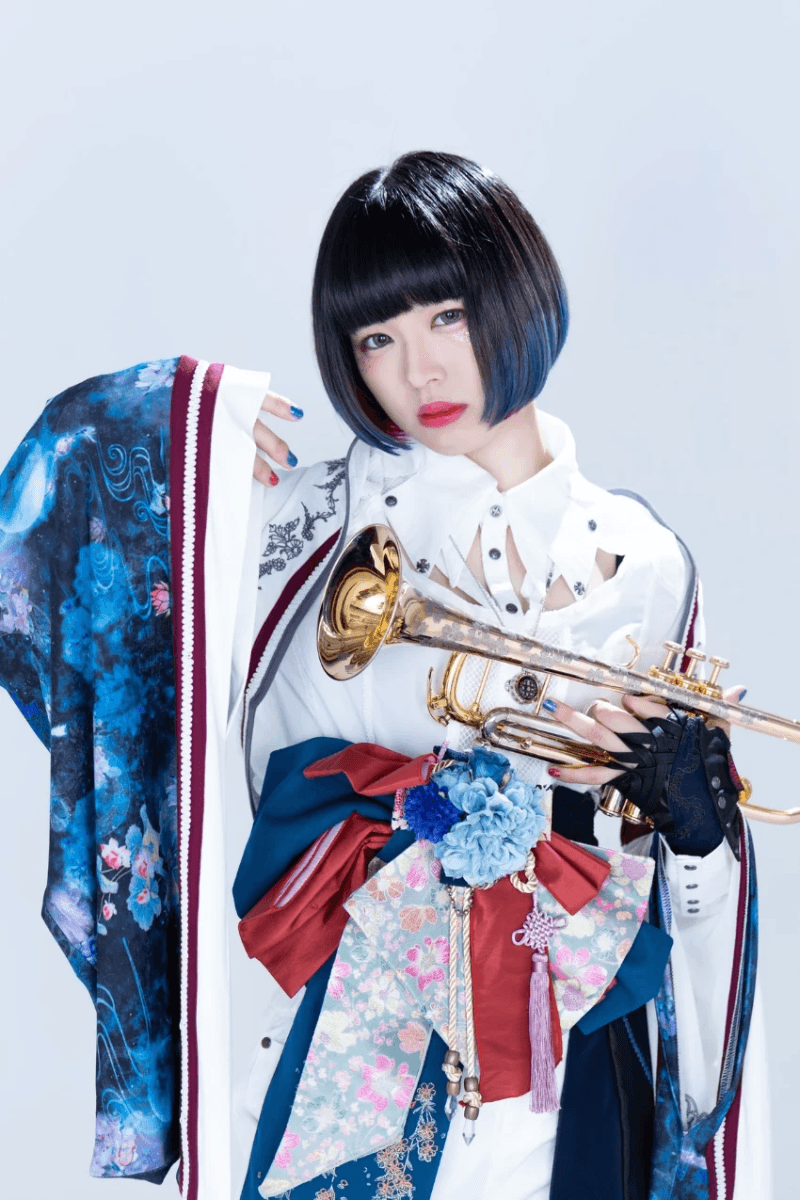 Riho Akiyama in a colorful kimono, holding her trumpet