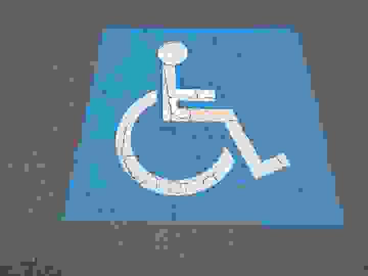 Architectural drawings on a table, rolled out with a ruler across them, and a 3D frame of a large building projecting out of the drawings Architectural drawings on a table, rolled out with a ruler across them, and a 3D frame of a large building projecting out of the drawings