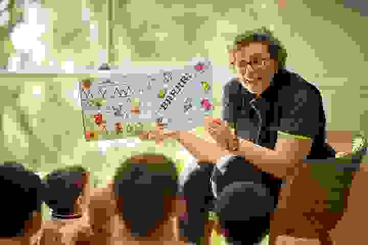 Educator reading to a group of children Educator reading to a group of children