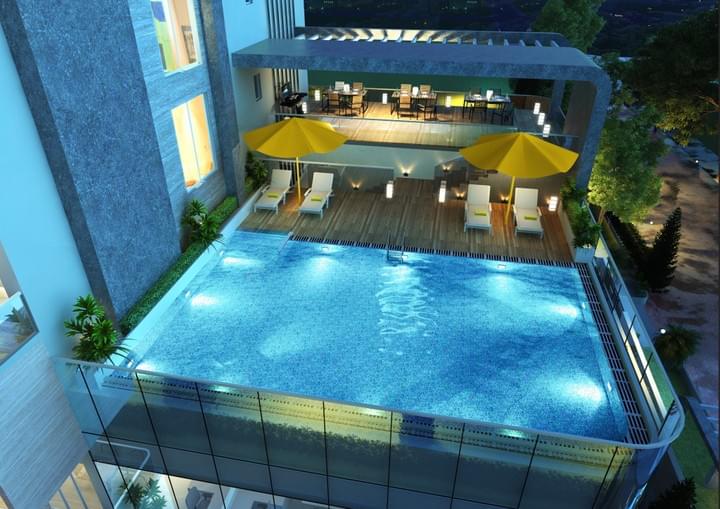 This picture shows the pool deck of the Tribute House.