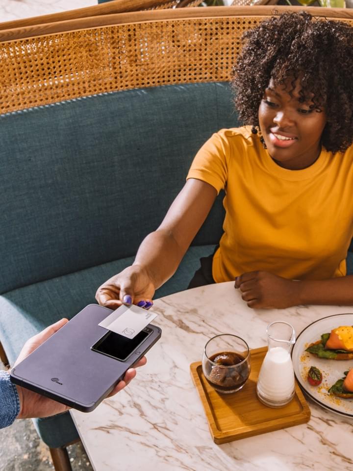 Customer paying with PAX M8 PayTablet