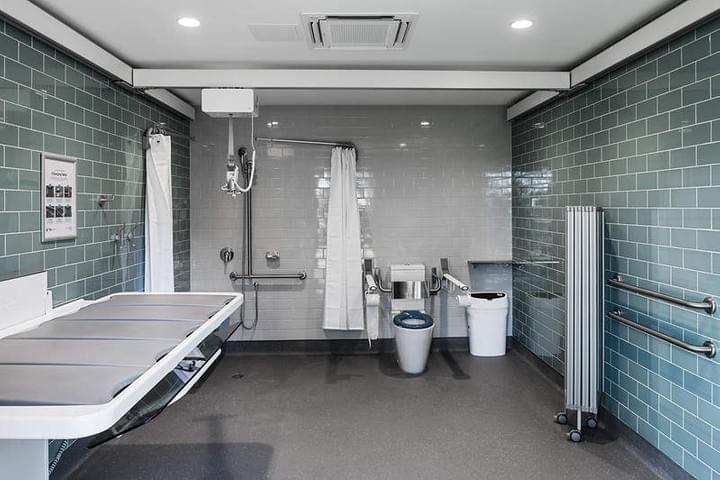 A group of people in front of the first Changing Places toilet in Ringwood Lake Park in 2014