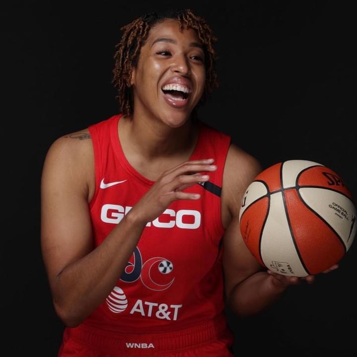 Tianna holds ball in Washington Mystics jersey