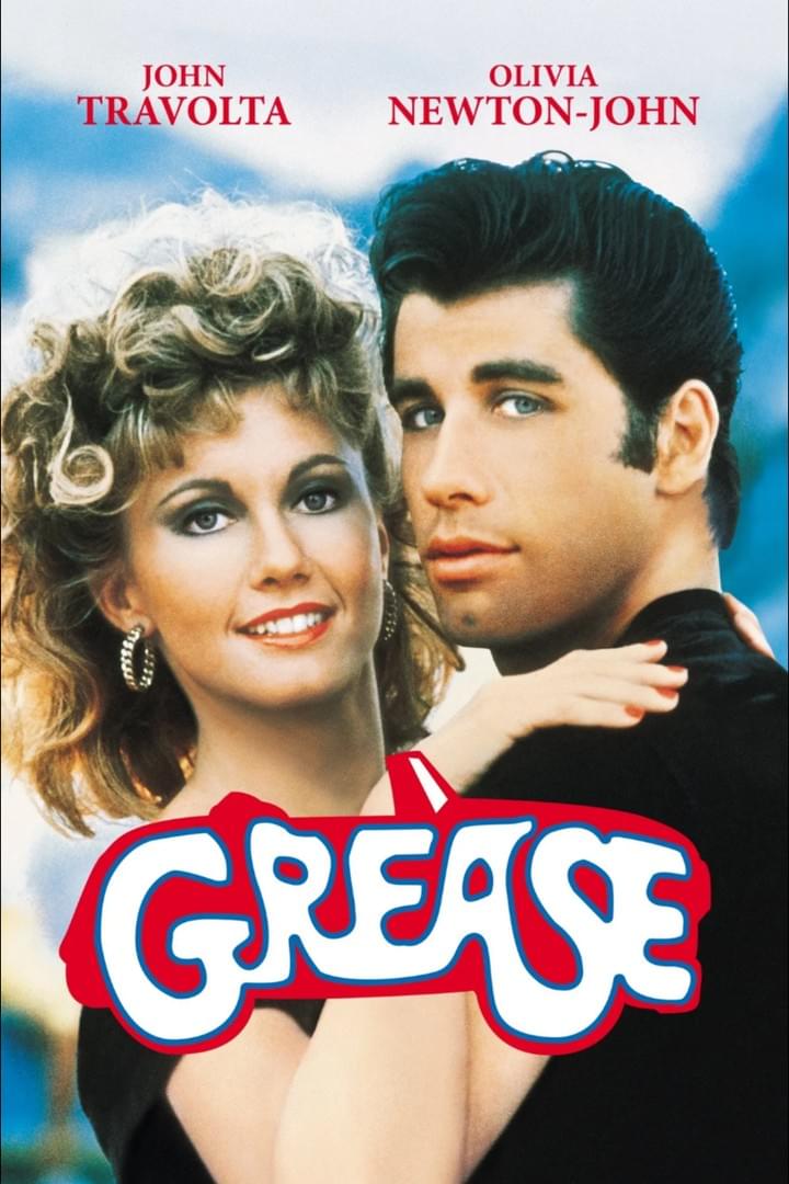 Movie poster featuring John Travolta and Olivia Newton-John for the film "Grease." The poster shows the two actors in a close embrace with the title in bold, stylized red and blue letters at the bottom, highlighting the romantic and nostalgic theme of the movie.