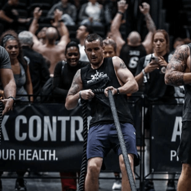 Coach Pete pulling the weighted sled
