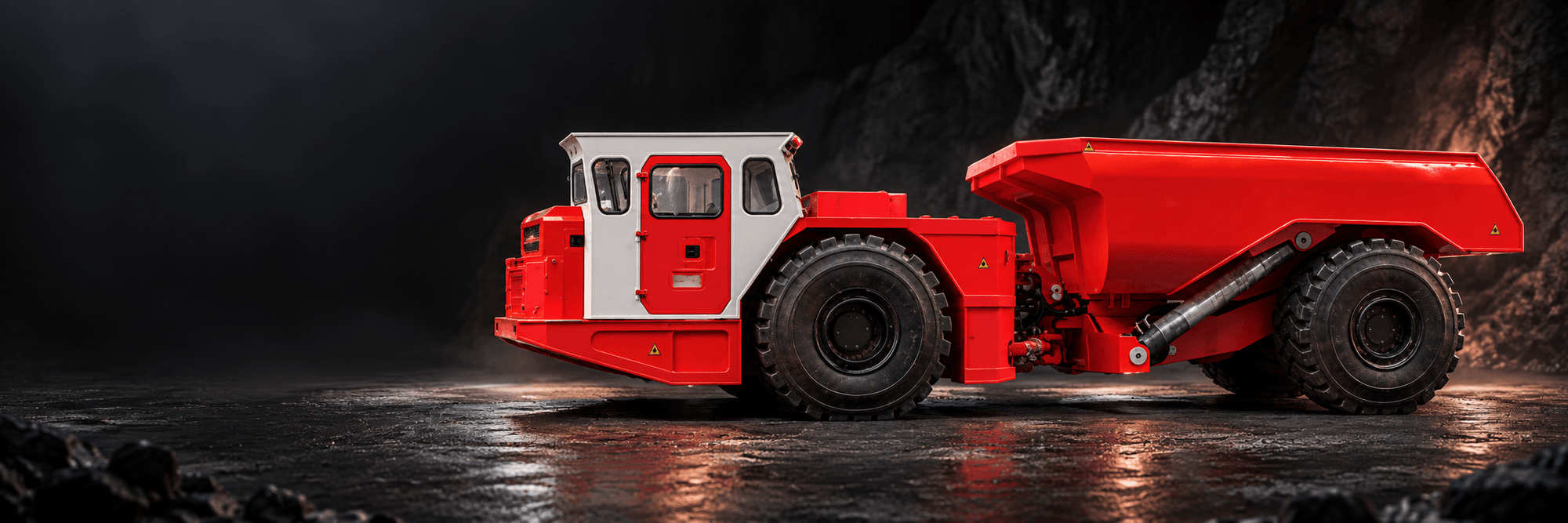 Representative visualization of a red underground mining truck with an enclosed operator cab