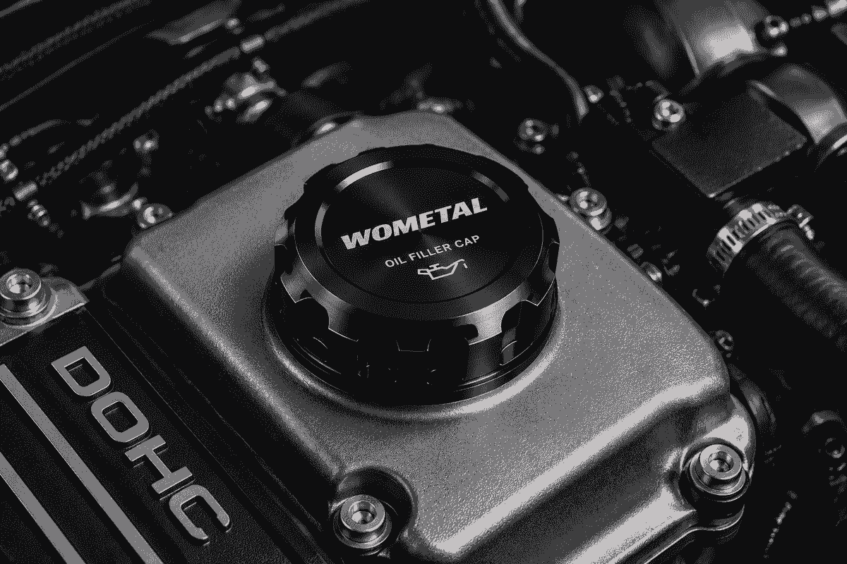 Billet aluminum oil filler cap installed on performance engine with CNC machined construction and premium anodized finish Billet aluminum oil filler cap installed on performance engine with CNC machined construction and premium anodized finish
