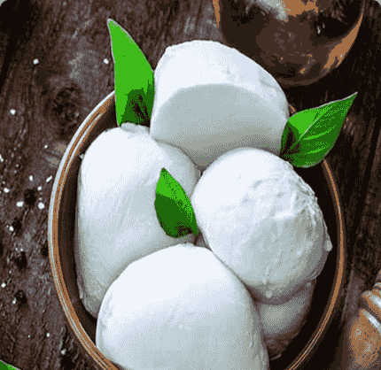 Fresh mozzarella balls with basil leaves in a terracotta bowl. Fresh mozzarella balls with basil leaves in a terracotta bowl.