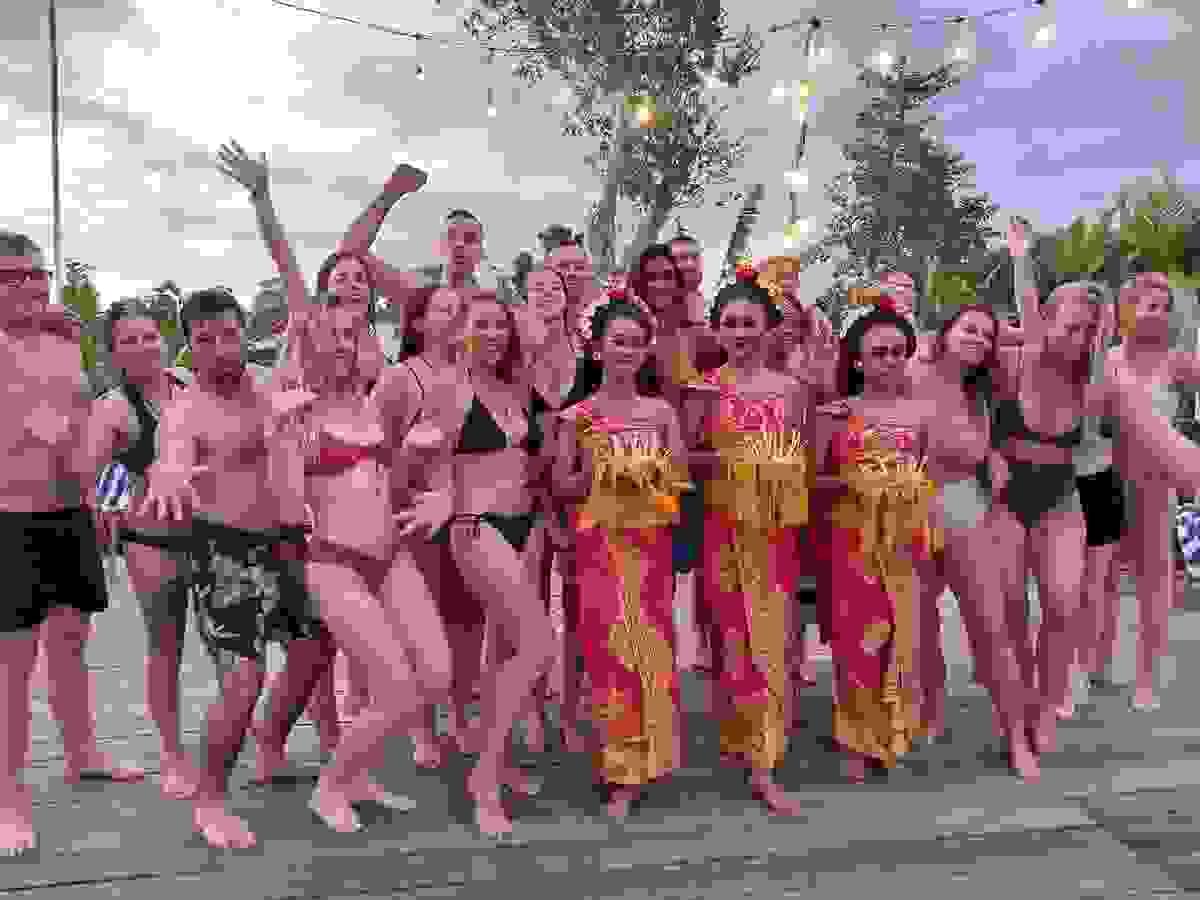 Retreat group pose with traditional Balinese dancers at Spaces Bali Retreat group pose with traditional Balinese dancers at Spaces Bali