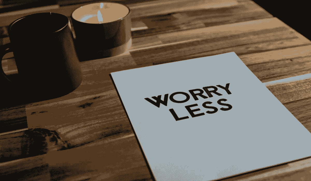 A table with two candles and a paper with the writing worry less representing stress and anxiety support with coping strategies from an online therapist. A table with two candles and a paper with the writing worry less representing stress and anxiety support with coping strategies from an online therapist.