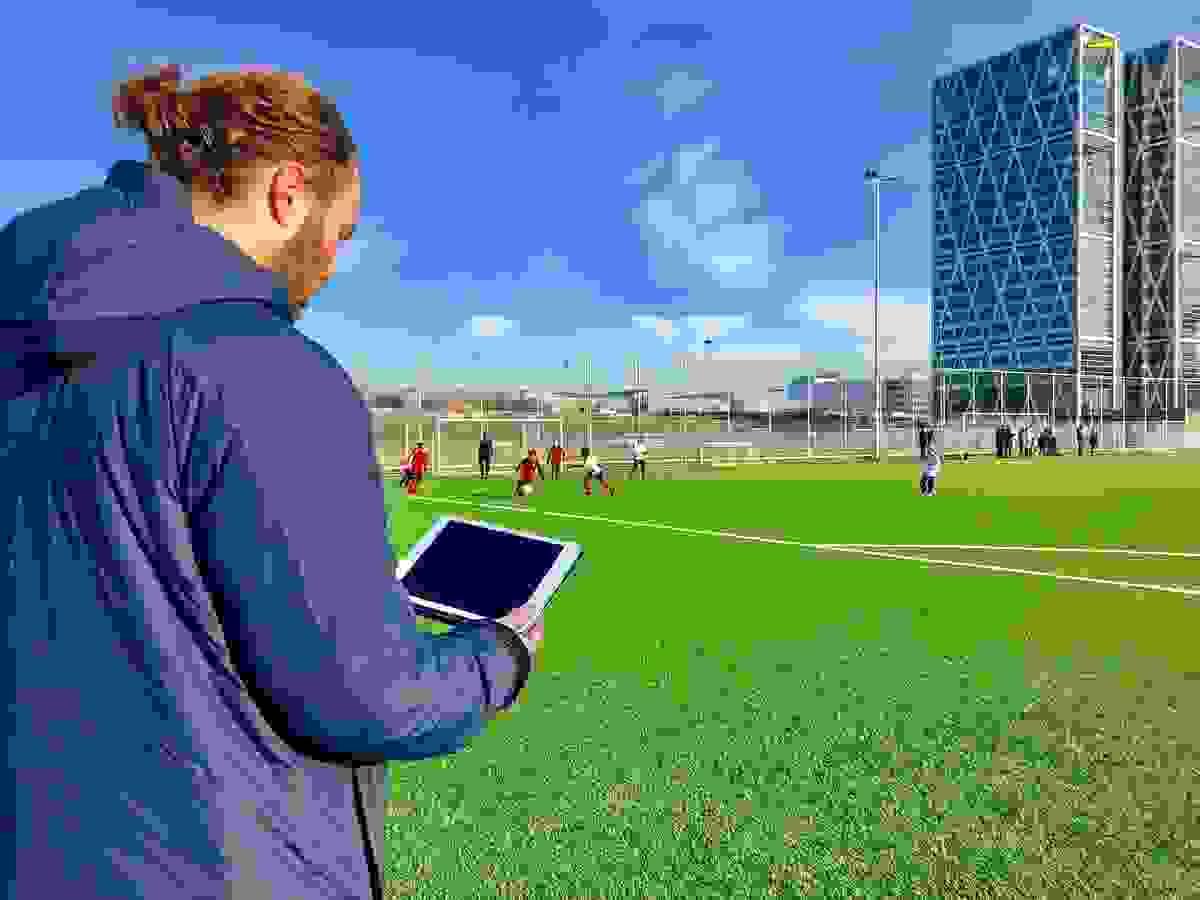 Professional coach tracking player performance with Gengee technology, embodying our long-term partnership ethos to empower football clubs at all levels. Professional coach tracking player performance with Gengee technology, embodying our long-term partnership ethos to empower football clubs at all levels.