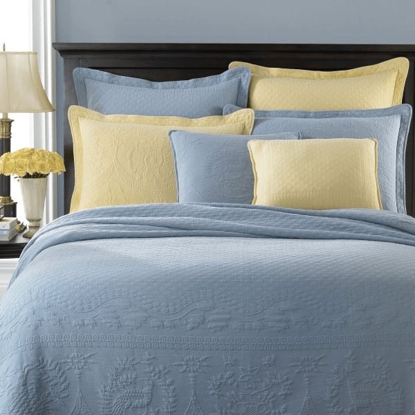 Pale yellow and white and light blue comforter