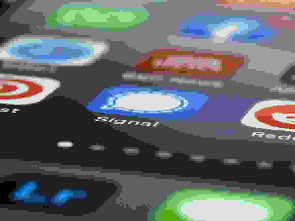 A close-up view of a smartphone screen displaying several app icons, with the central focus on the blue “Mail” app icon featuring a white envelope. A red notification badge with the number “2” appears in the top-right corner of the icon, indicating two unread emails. Surrounding the Mail icon are partial views of other apps, including a news app and the BBC News app, suggesting a mix of communication and information tools. The image highlights mobile connectivity and digital engagement, emphasizing themes of responsiveness, information flow, and the everyday presence of technology in personal and professional life A close-up view of a smartphone screen displaying several app icons, with the central focus on the blue “Mail” app icon featuring a white envelope. A red notification badge with the number “2” appears in the top-right corner of the icon, indicating two unread emails. Surrounding the Mail icon are partial views of other apps, including a news app and the BBC News app, suggesting a mix of communication and information tools. The image highlights mobile connectivity and digital engagement, emphasizing themes of responsiveness, information flow, and the everyday presence of technology in personal and professional life
