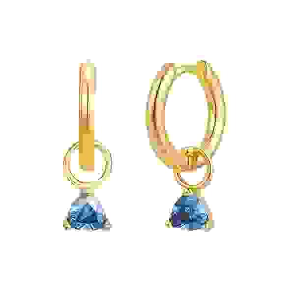 old Trip recently started making birthstone jewelry, like these December charms ($33 each) with blue topaz–colored CZ, shown on huggie hoop earrings ($47 per pair). 