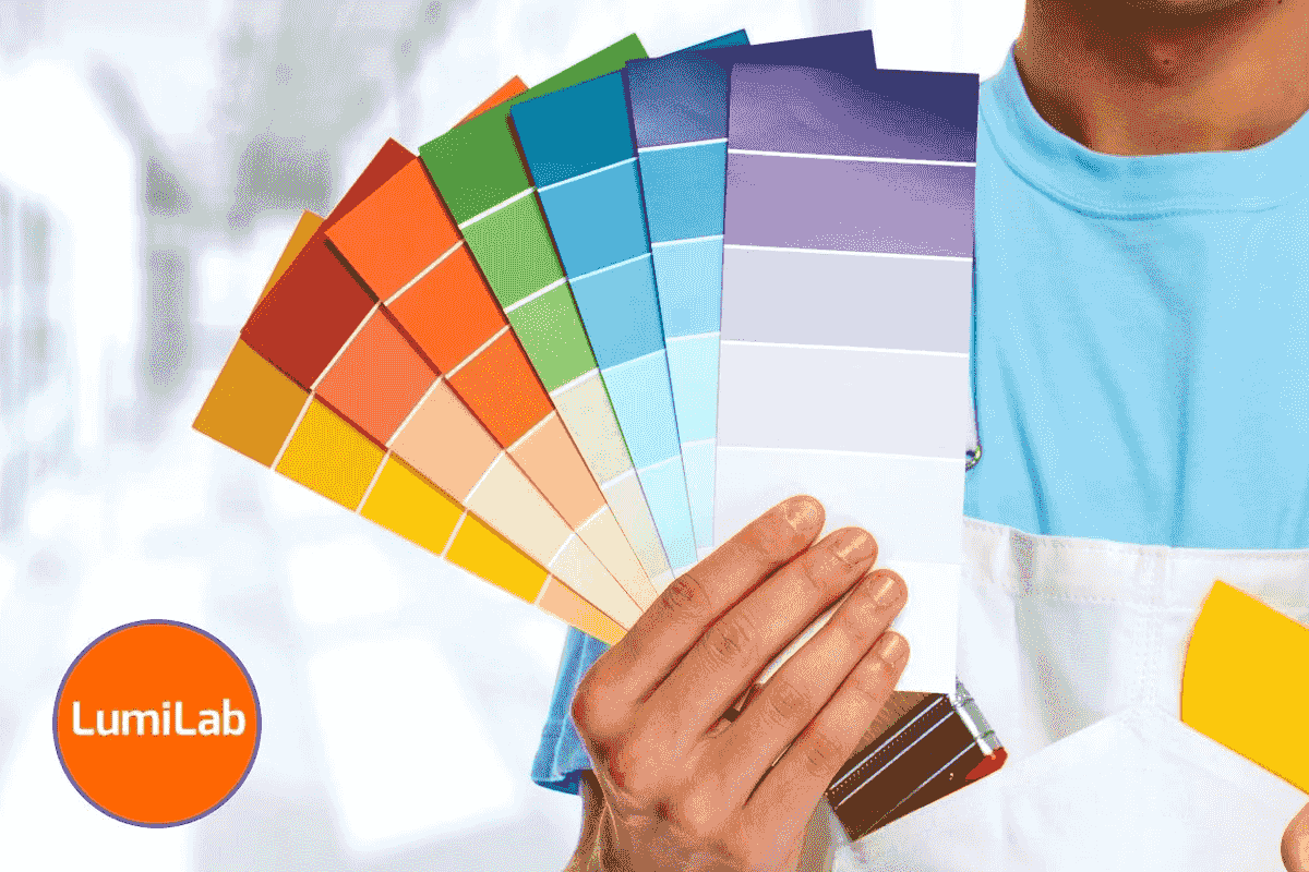 A person holding vibrant paint color swatches. A person holding vibrant paint color swatches.