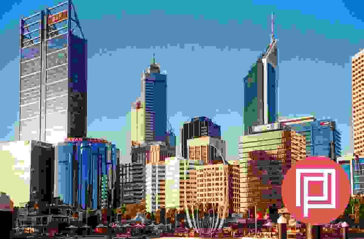 Two architects are working on marking up a drawing on a desk Two architects are working on marking up a drawing on a desk