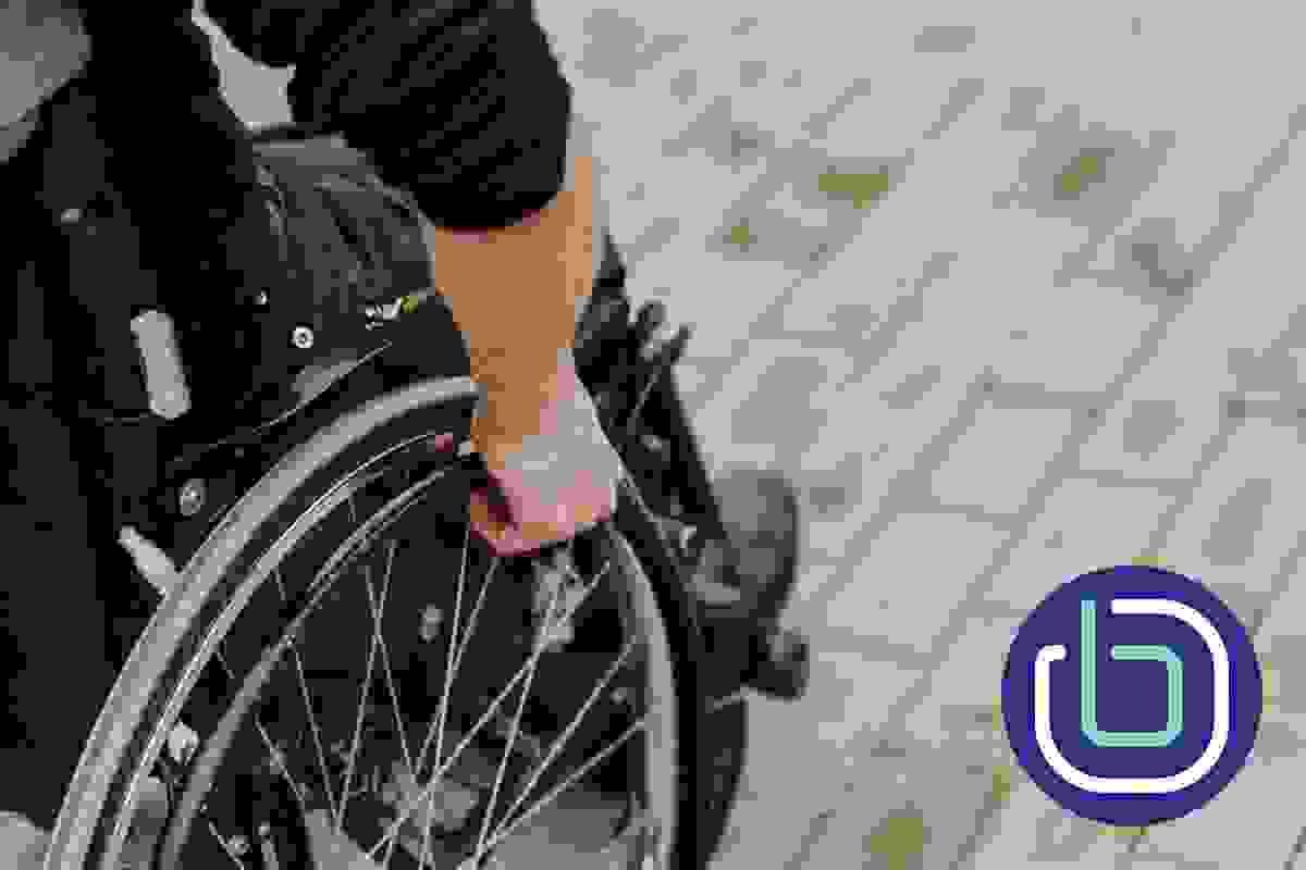 A close up of a wheelchair users hand A close up of a wheelchair users hand