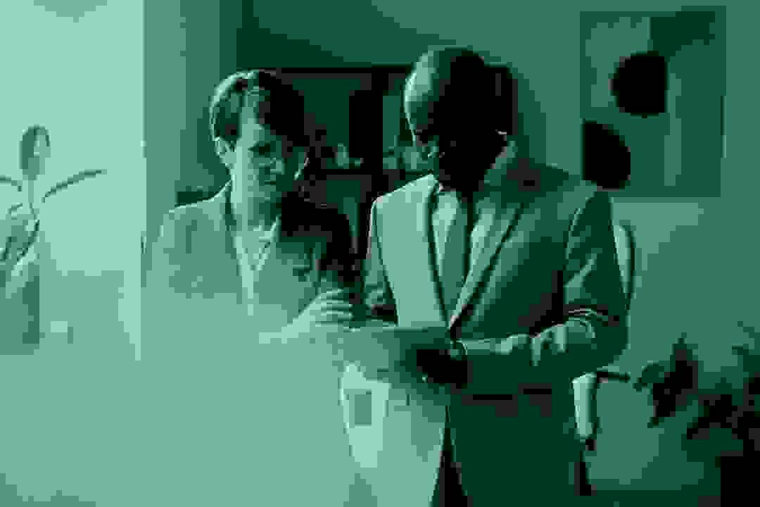 Professional service provider working at a desk with client paperwork, representing service-based businesses Professional service provider working at a desk with client paperwork, representing service-based businesses