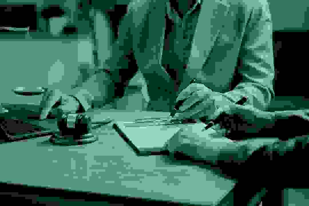 Lawyer presenting estate and financial documents in a professional setting Lawyer presenting estate and financial documents in a professional setting